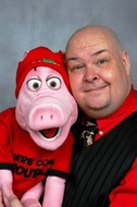 Neale Bacon with PIG puppet.