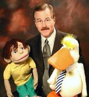 Performer Mike Randall (USA) with BENNY puppet.